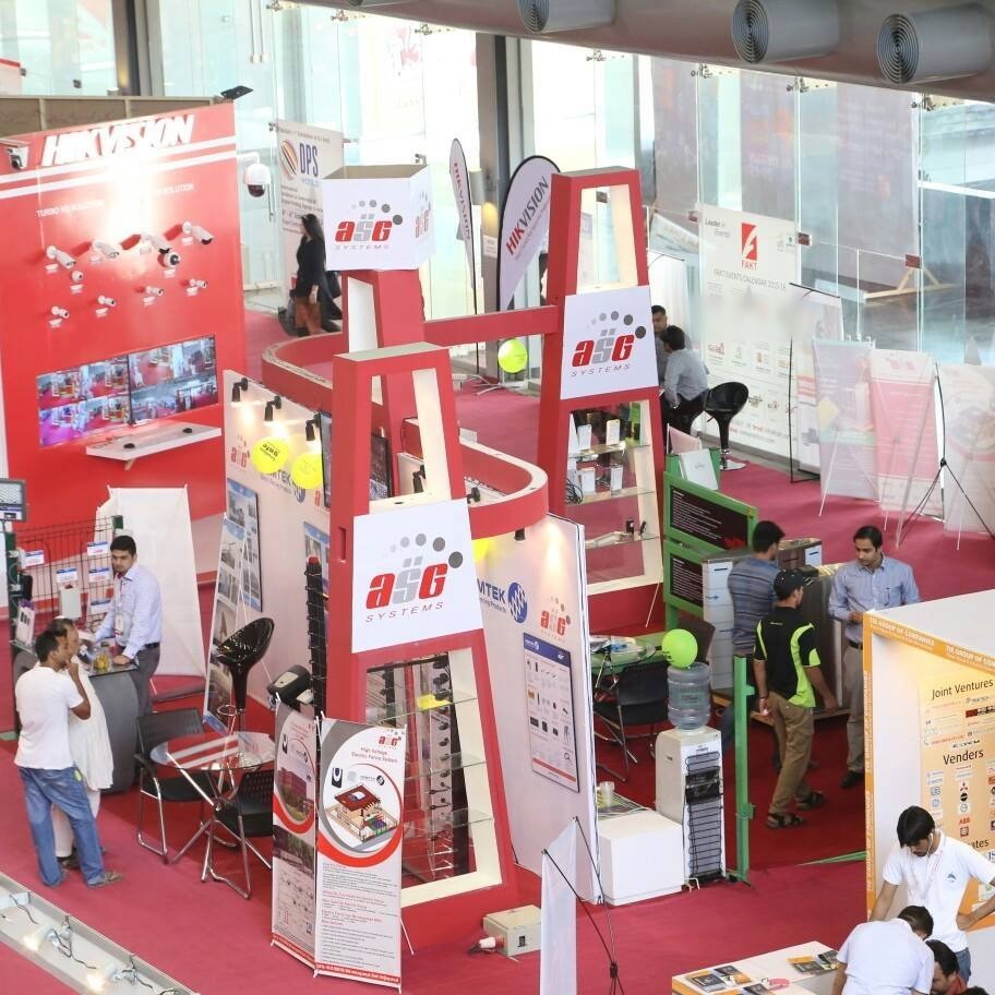 ASG Systems exhibition stand with red towers, electric fence display and product showcases