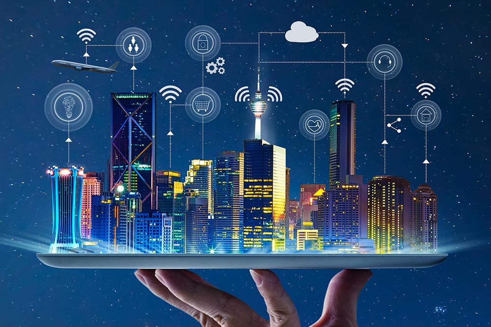 Building management system concept showing a smart city skyline on a tablet with connected IoT icons