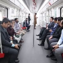 Commuters riding the Orange Line Metro Train after clearing security screening