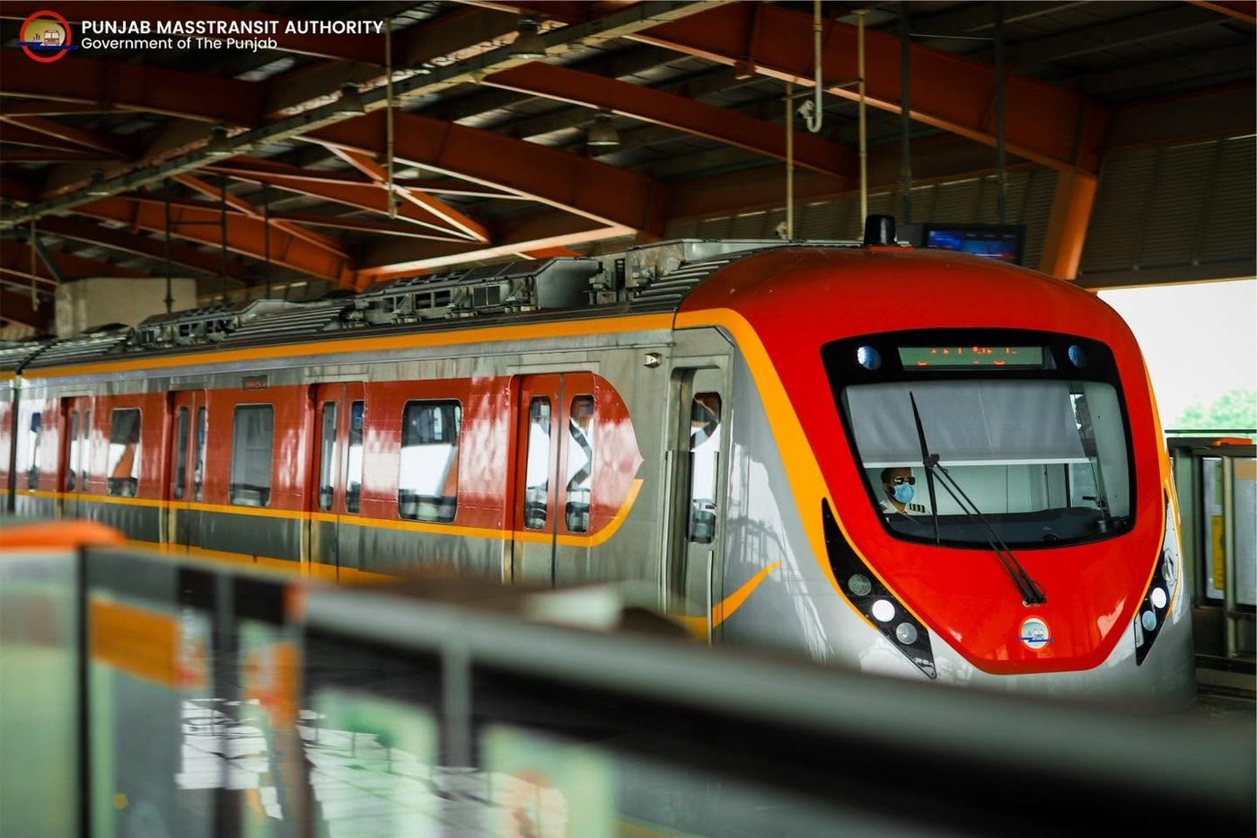 Orange Line Metro Train at a station platform in Lahore, Punjab Masstransit Authority