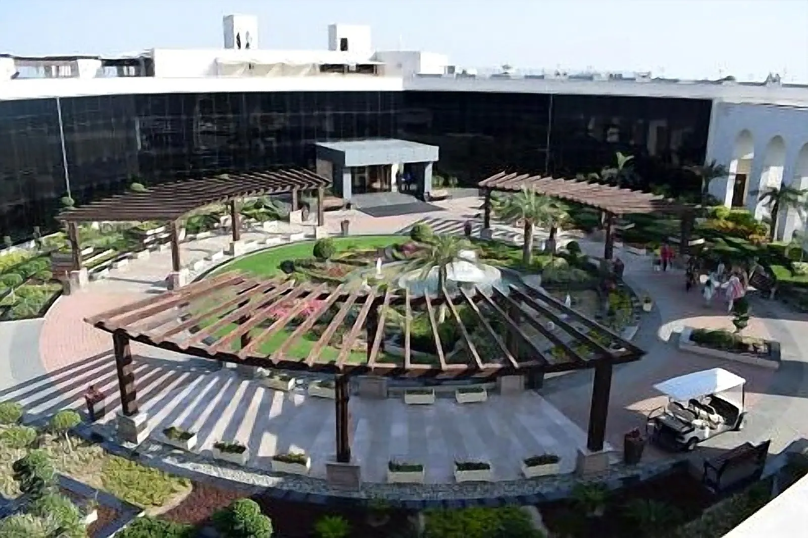 Aerial view of the clubhouse courtyard and gardens at DHA Raya Golf & Country Club