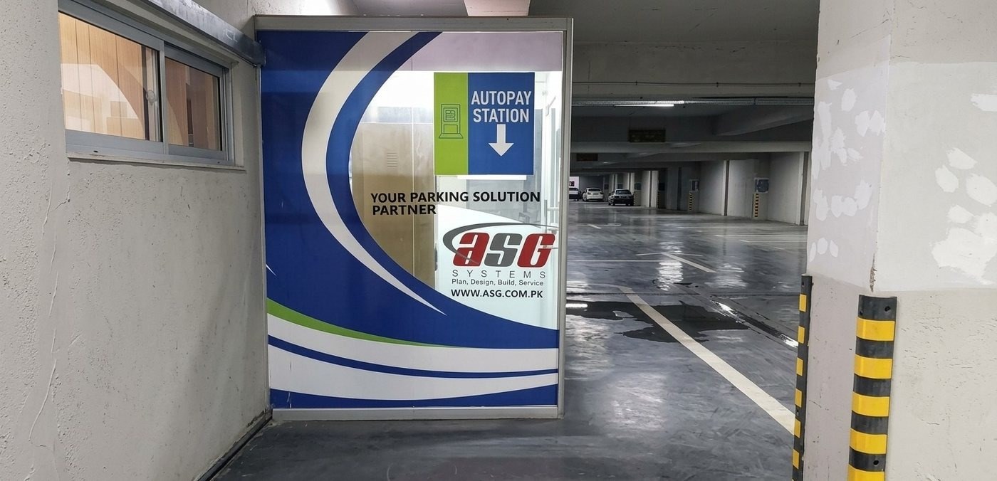 Autopay Station signage branded by ASG Systems Pakistan at Raya Fairways parking facility