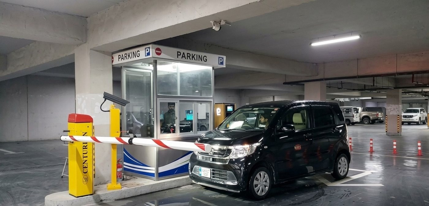 Centurion automatic boom barrier checkpoint with attendant booth and vehicle at Raya Fairways