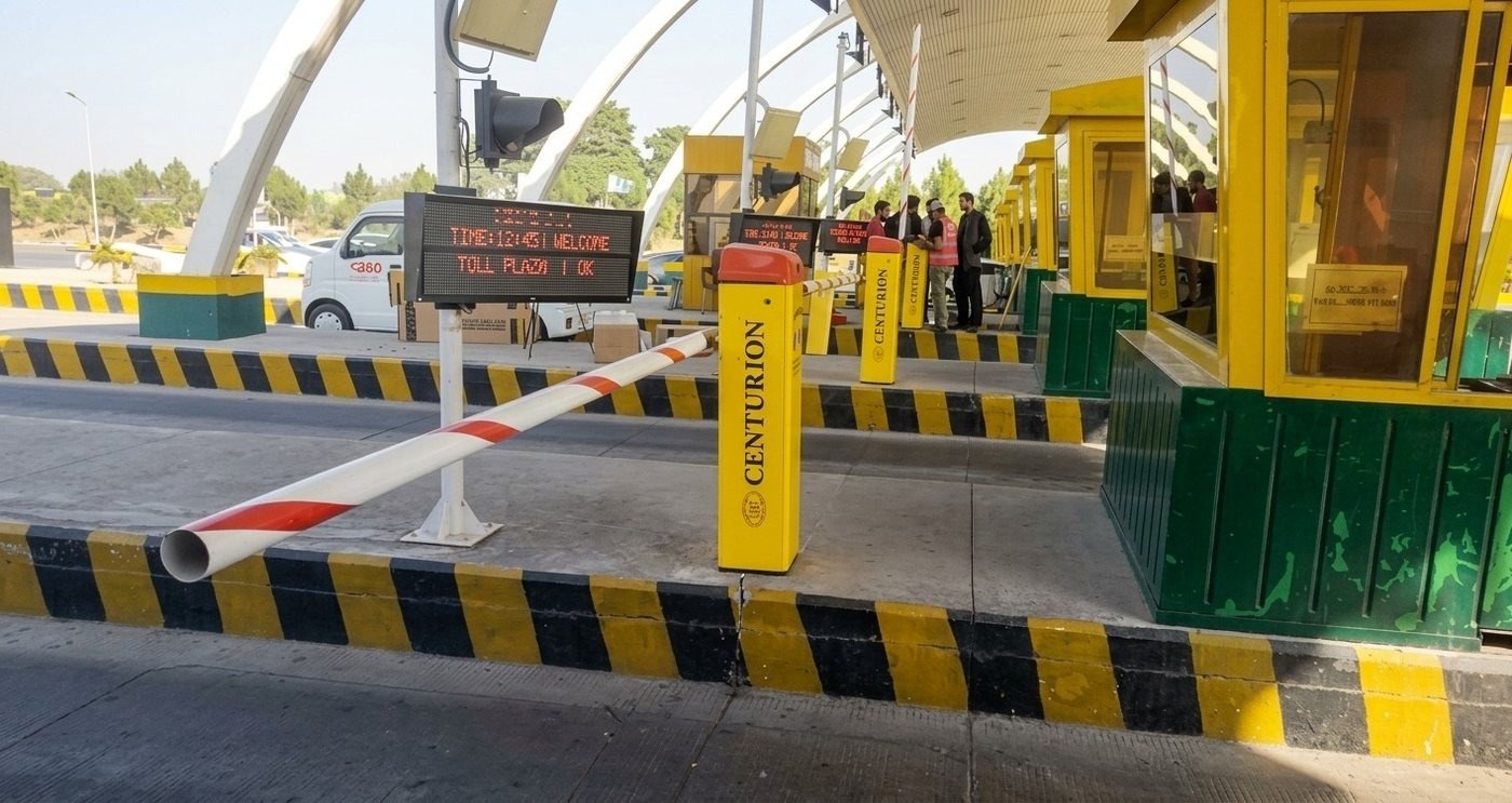Centurion high-speed boom barrier with digital welcome display at Islamabad Toll Plaza express lane