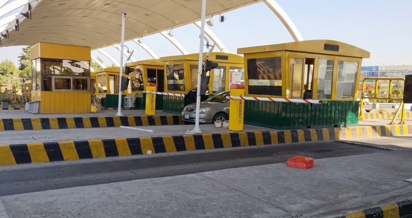 Row of toll booths with Centurion automatic boom barriers at Islamabad Toll Plaza